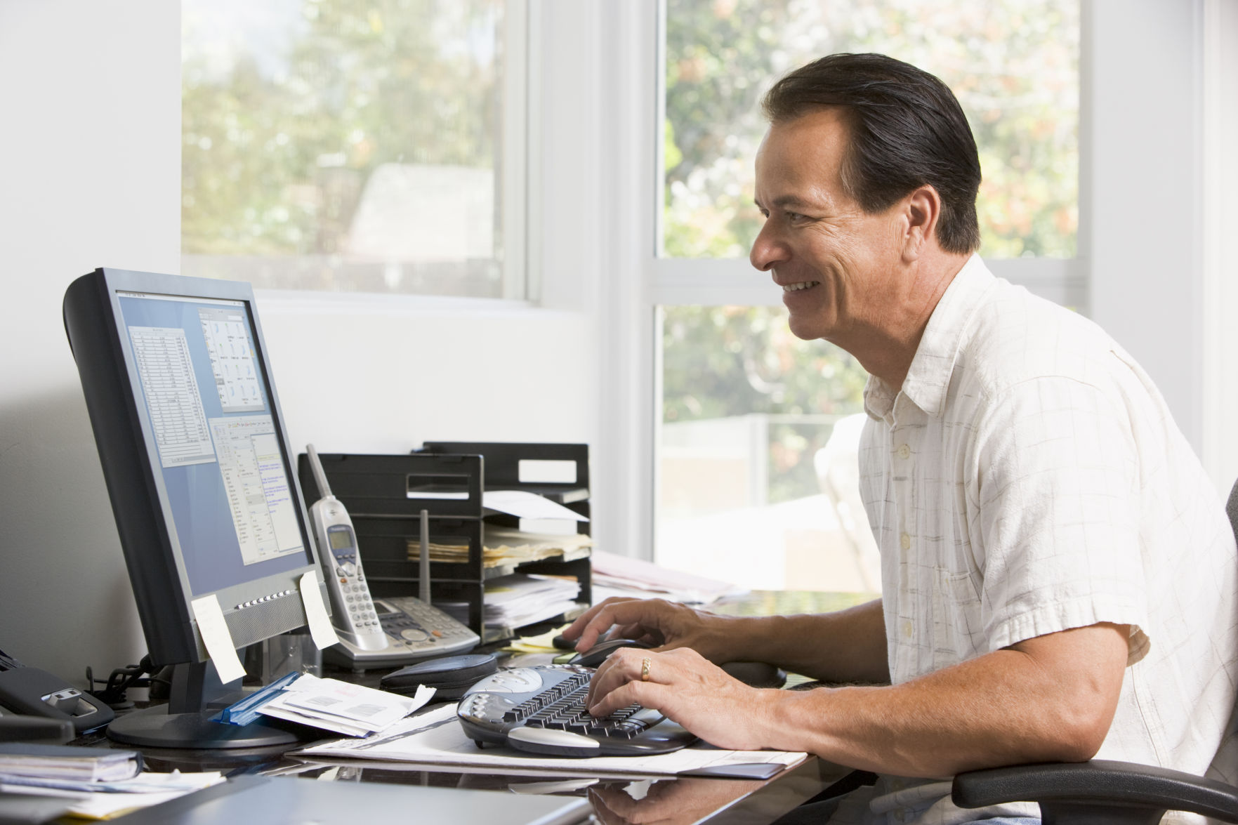 Man in home office at computer